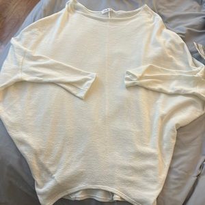 Off-white, oversized, mid-length sleeve top.